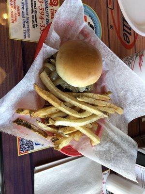 Small burger and half fries. A little messy with ketchup and mustard but quite tasty. Get the grilled onions.