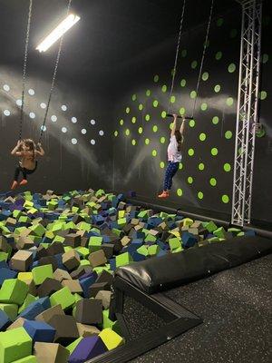 Huge foam pit with swing and trapeze bar