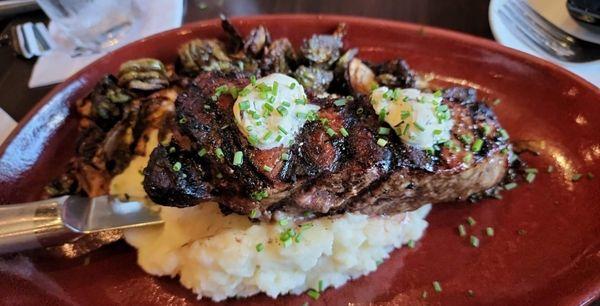 New York strip w/herb & truffle butter, crispy brussels, & buttermilk mashed potatoes.