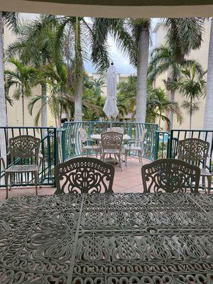 Covered Patio overlooking condo courtyard with fountains