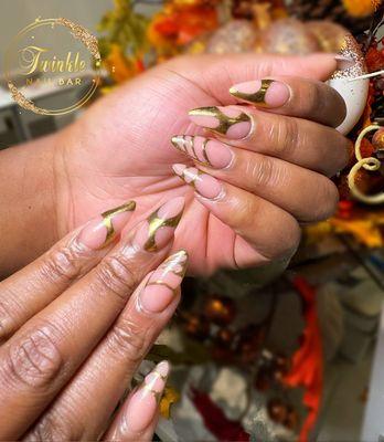 A touch of elegance. Gold details are a timeless and sophisticated addition to any nail design.