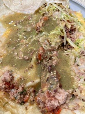 Ground beef burro doused in green sauce