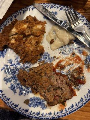 Fried chicken, meat loaf, and some mashed potatoes.