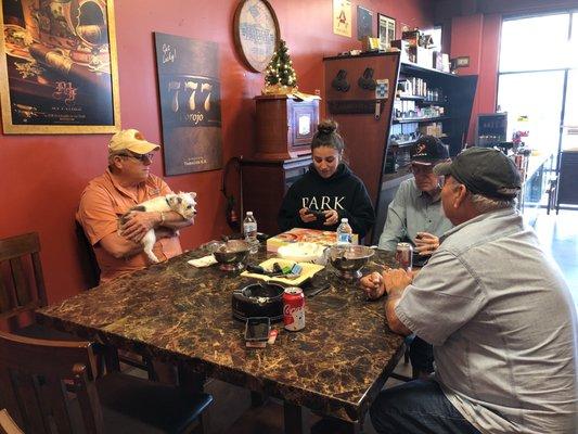 Customers enjoying cigars in the store