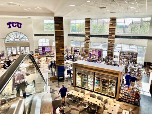 TCU Bookstore view over clothing and Starbucks coffee shop from upstairs books area