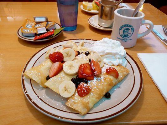 The Fresh fruit Crepe! W/strawberry Blueberry& bananas!  W cream on the side! & hot tea!