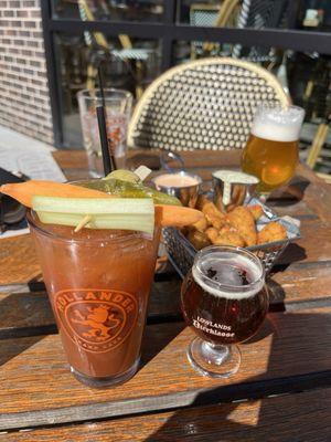 Bloody Fresca Bloody Mary with complementary beer chaser. Cheese Curds basket with sriracha ranch and charred poblano buttermilk sauce.