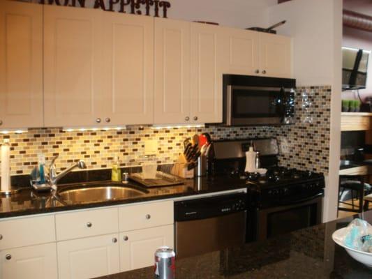 under cabinet lighting with glass back splash Wrigleyville