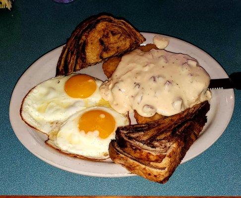 "Chicken fried pork" with sausage gravy, eggs, and marble rye.