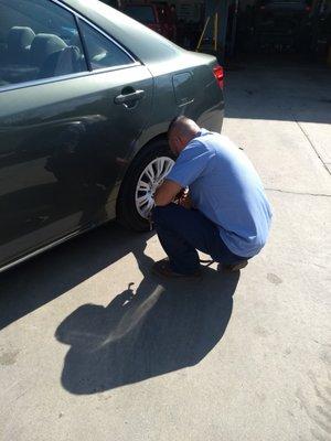 Jesus making sure my tire is perfect.