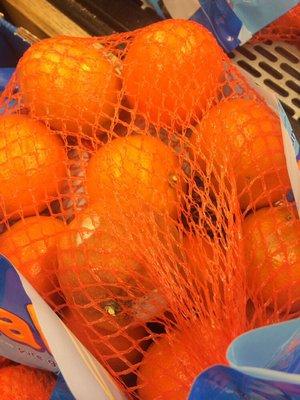 Another bag with rotted oranges for sale.