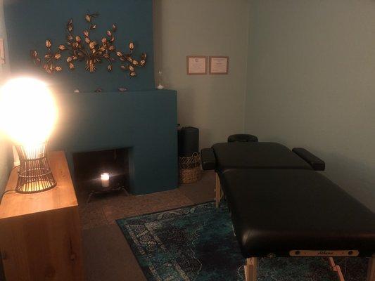 Massage room with candles and soft lighting