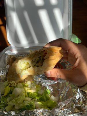 Ok this is bad lighting, but here I am holding my beloved chicken empanada from Tacos El Brother.