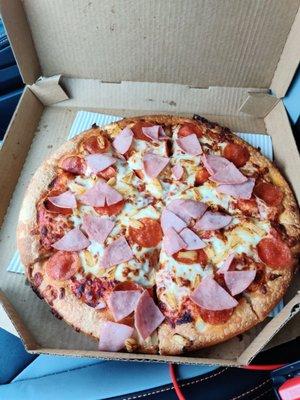 Hot pizza with some strangely warm ham