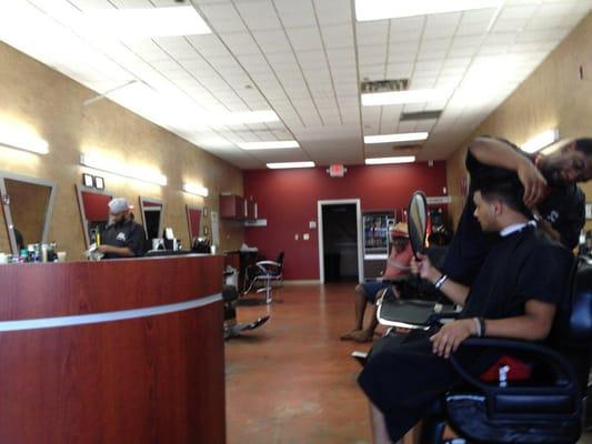 At the barbershop, gettin it hooked up.