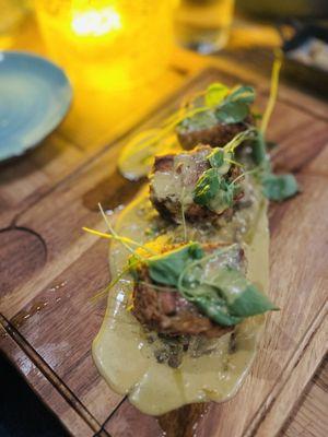 Pork Trio- It is three types of pork fried in a crispy crust on a bed of coconut spaghetti squash with lentils. Delicious!