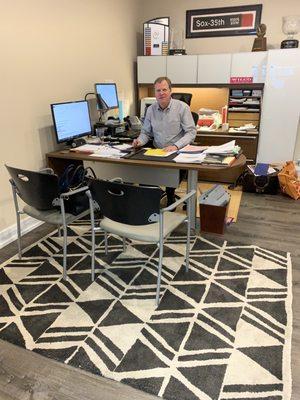 Dave at his desk.  The extra screen makes it easy to follow his analysis of my accounts.