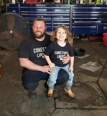 Owner Joe in the shop with his son and future mechanic, Joey, Jr.