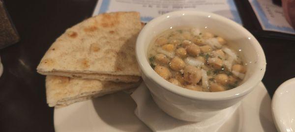 Complimentary pita and chickpea dip