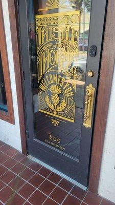 Front door of Thistle and Thorne 304 Harrison, downtown Panama City, FL