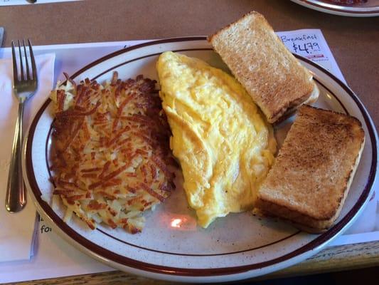 Cheese omelet, hash browns and white toast.