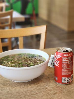 Beef pho, with Coke can for size reference.