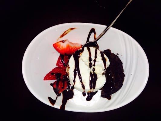 Dark/semi-sweet chocolate brownie wafers with vanilla ice cream and fresh strawberries. Not too sweet, but super yummy!