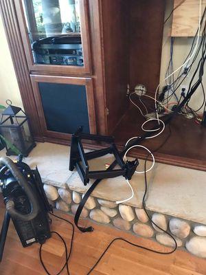 Installing a wall mount for a TV and wired surround Sound