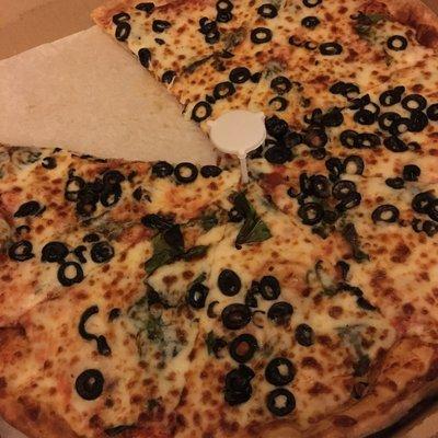 Large pizza, black olives and baby spinach