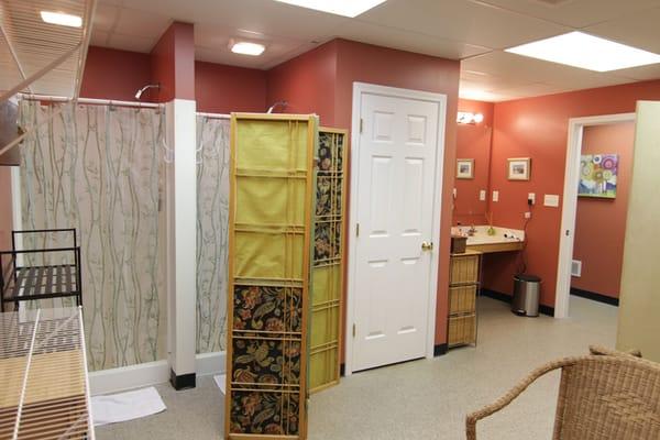 Women's changing room: full vanity, two showers, private bathroom, sitting area, plenty of storage for hanging clothes and bags!