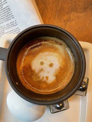 Skull latte with oatmilk and cinnamon with the New York Times in the morning before work