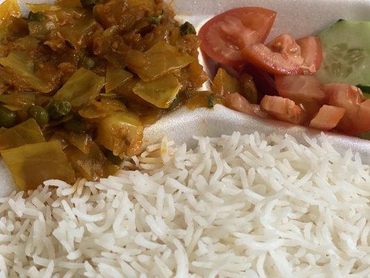 Up close of rice, salad, and a yummy cabbage dish