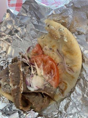 My half eaten Gyro shows the tomato, onion and sauce