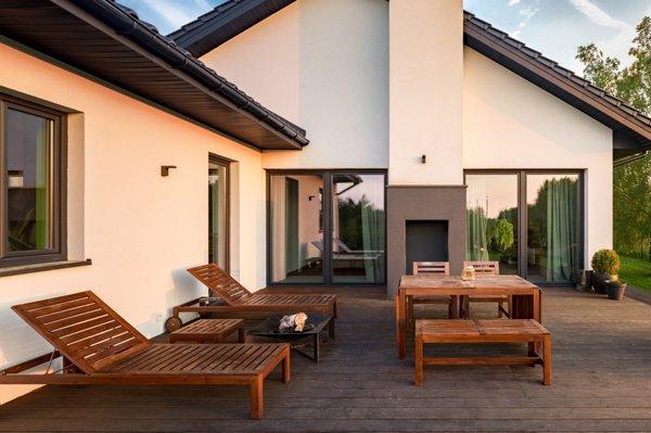 Beautiful Backyard sitting area. 
 New Deck, Sliding Doors, Windows and Cool Life Exterior paint.
 Sunset Home Builders INC.