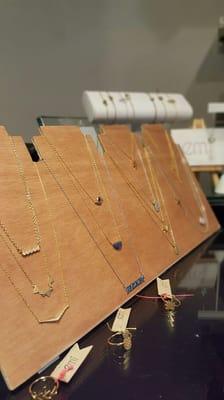 Kollage Salon sells Emi Designs jewelry. 

Emi specializes in handmade custom designs for gifts, bridal parties, charitable events and more.