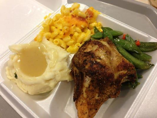 Baked chicken, mashed potatoes and gravy, macaroni and cheese and snow peas