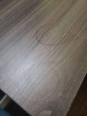 Beverage stains from unwiped bedside table surfaces