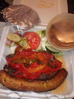 Steak with Onions and peppers.yellow rice,Black beans,salad and tortillas.