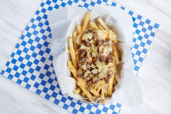 Try our Phanatic Fries!  Hand cut, skin on french fries with cheese whiz and marinated rib eye steak.  Enough to share!