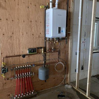 Radiant floor heat boiler combi system, 90% installed.