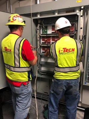 i-Tech Employees working on Access Control Panels