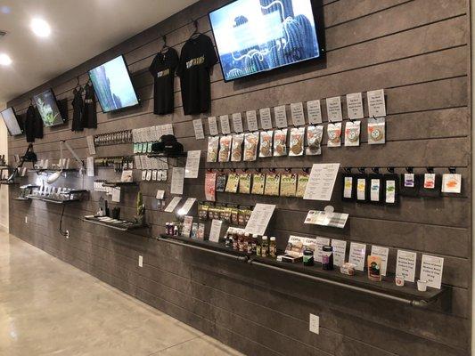 Products on an open wall display, broken up into categories for ease!  Browse your options, while you speak to their knowledgeable staff!