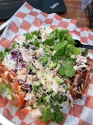 Chopped salad with $5 smoked chicken add-on. More onions than chicken. Do not waste your $ on this one.