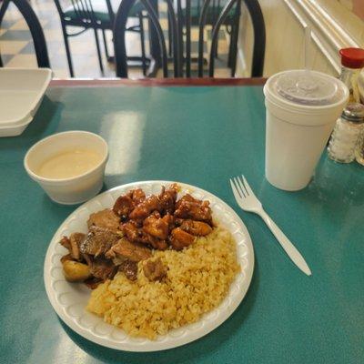 My plate, hibachi steak, and chicken with rice and yum yum sauce.