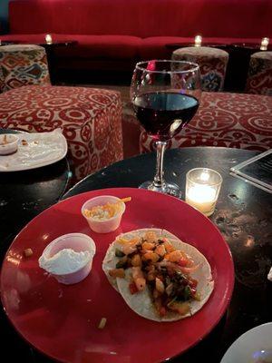 Tasty shrimp tacos appetizers, glass of Pinot Noir