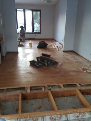 Dining room during - Angel's team secured the framing and blended in new floor boards