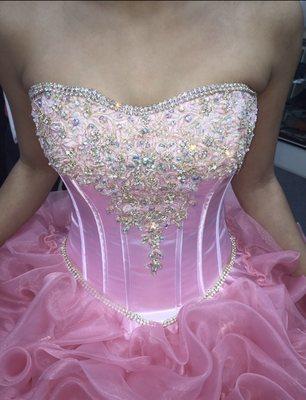 The beautiful detail of the corset section of her dress! Picture does no justice!