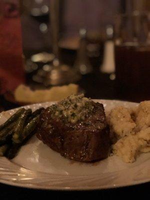 Filet mignon with a pine nut gorgonzola butter topper, roasted asparagus and cauliflower garlic mash potato