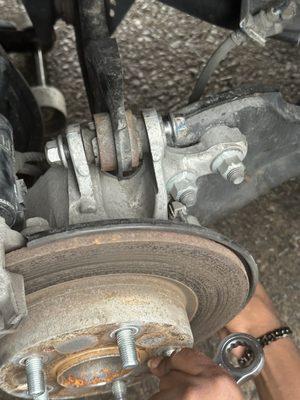 Loose bolt on control arm left by Farr Family.