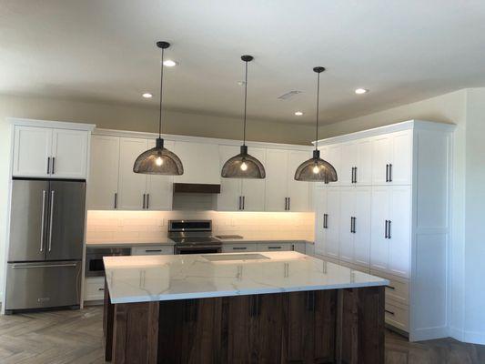 Kitchen. Love the lighting, walnut island, microwave drawer and all the storage!